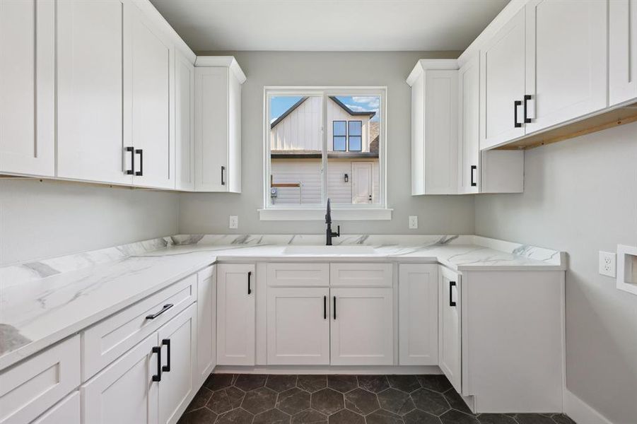 Utility Room with Tile Floors, Shaker Style Cabinetry, Sink, Window & Abundant Storage