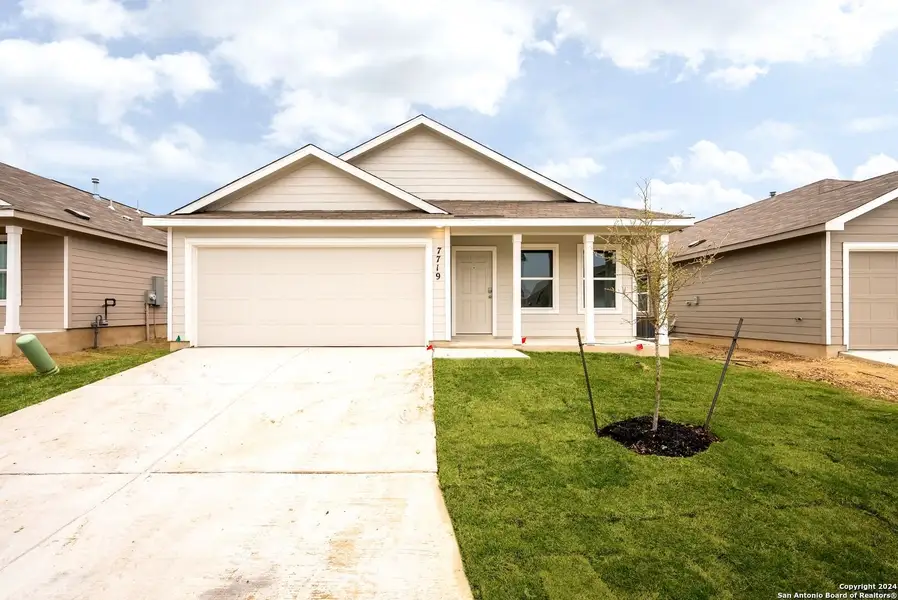 Front exterior of a new home in Torian Village, San Antonio, TX, highlighting curb appeal (Image 1). Front exterior of a new home in Torian Village, San Antonio, TX, highlighting curb appeal (Image 1).