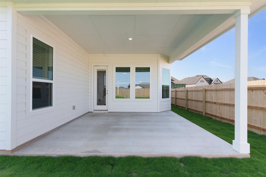 A spacious covered patio provides an ideal setting for outdoor entertaining and relaxation.