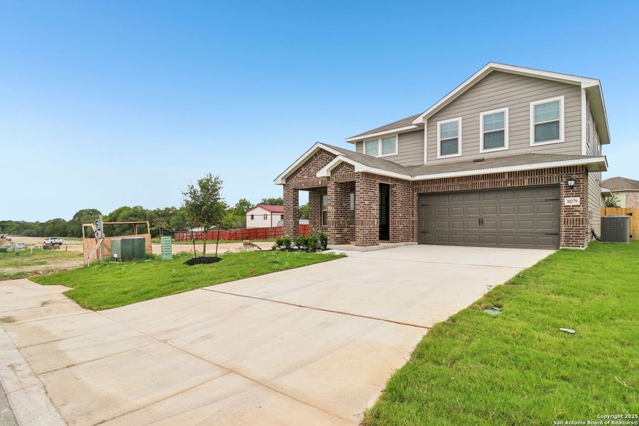 Front exterior of a new home in Royal Crest, San Antonio, TX, highlighting curb appeal (Image 31). Front exterior of a new home in Royal Crest, San Antonio, TX, highlighting curb appeal (Image 31).