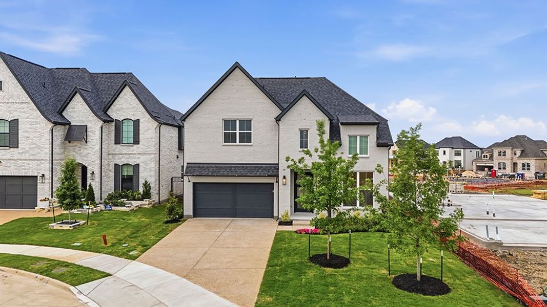 Front exterior of a new home in Brookhollow West, Prosper, TX, highlighting curb appeal (Image 25). Front exterior of a new home in Brookhollow West, Prosper, TX, highlighting curb appeal (Image 25).