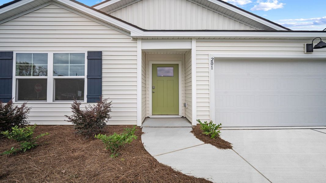 Front exterior of a new home in Holly Oaks, Statesboro, GA, highlighting curb appeal (Image 2). Front exterior of a new home in Holly Oaks, Statesboro, GA, highlighting curb appeal (Image 2).