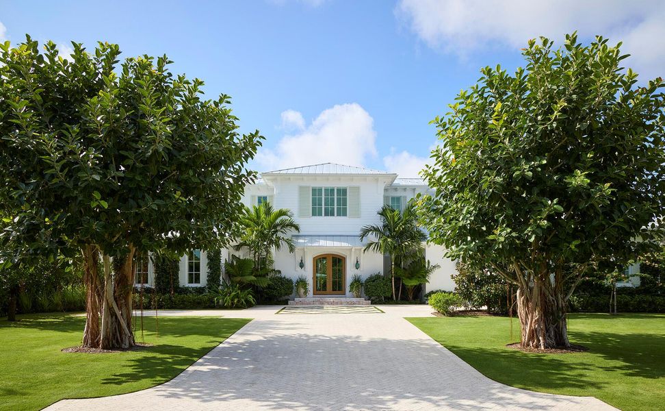 Front exterior of a new home in , North Palm Beach, FL, highlighting curb appeal (Image 19). Front exterior of a new home in , North Palm Beach, FL, highlighting curb appeal (Image 19).