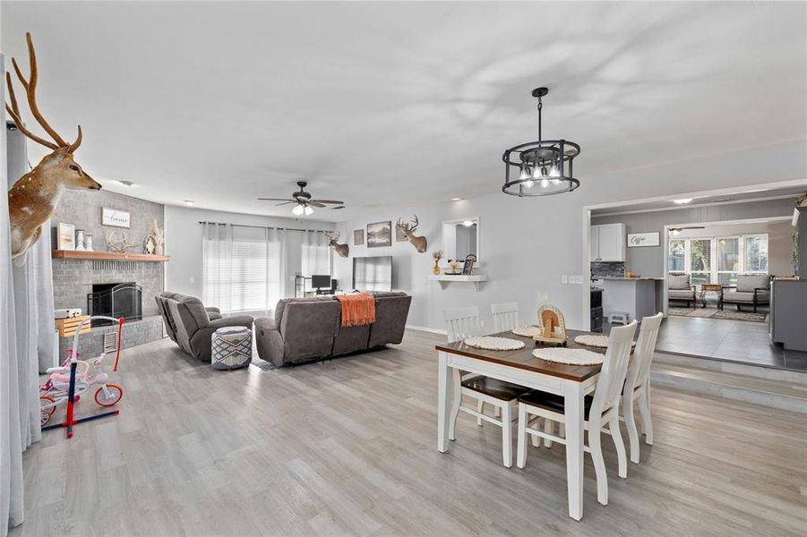 Large living and dining area with fireplace