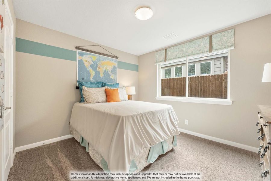 Children's bedroom with carpet, teal accent stripe on wall, world map poster, and single bed with colorful pillows Children's bedroom with carpet, teal accent stripe on wall, world map poster, and single bed with colorful pillows