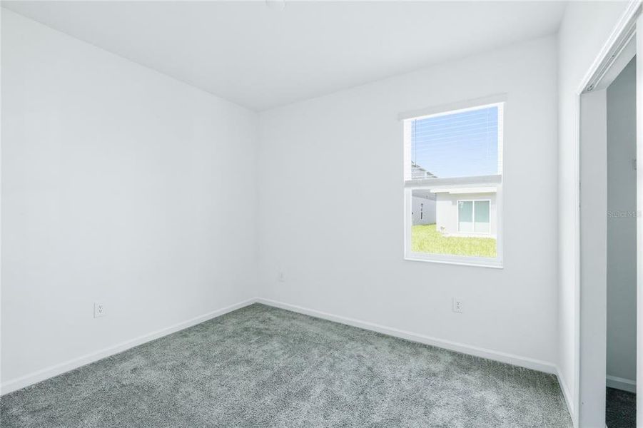 Spacious, unfurnished interior of a new home in Peace Creek Reserve, Winter Haven (Image 16).