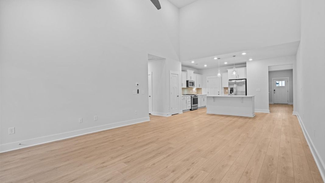 Exclusive living space with towering ceilings, tasteful finishes, and a warm, welcoming feel