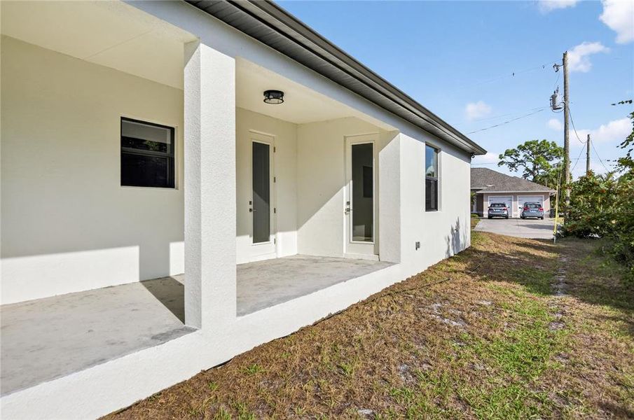 Exterior details and patio area of a home in , North Port (Image 29).