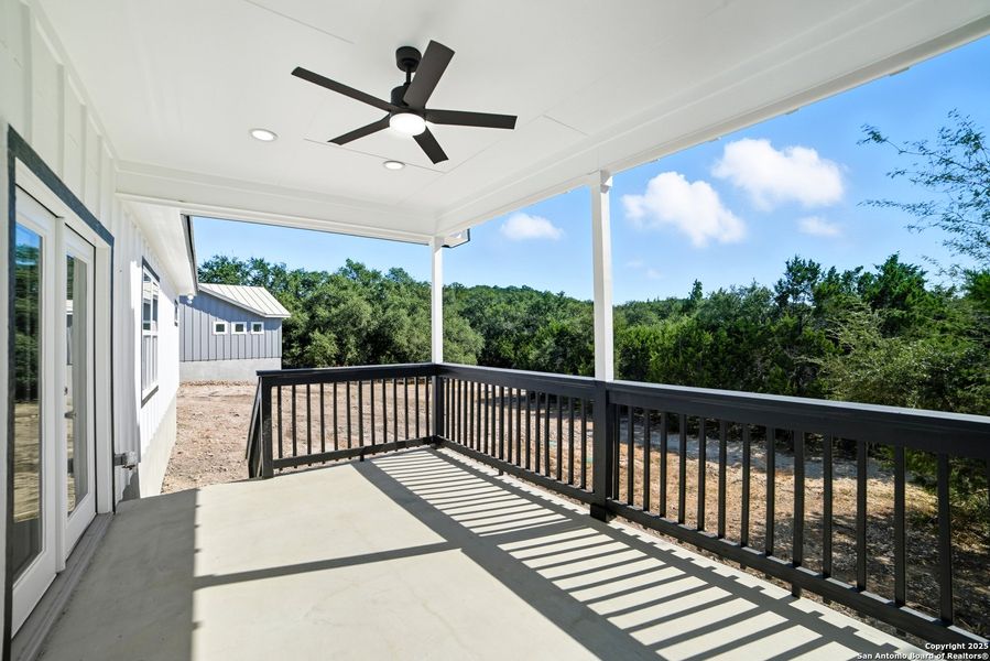 Exterior details and patio area of a home in , Lakehills (Image 3).