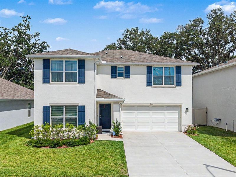 Front exterior of a new home in , Spring Hill, FL, highlighting curb appeal (Image 24). Front exterior of a new home in , Spring Hill, FL, highlighting curb appeal (Image 24).