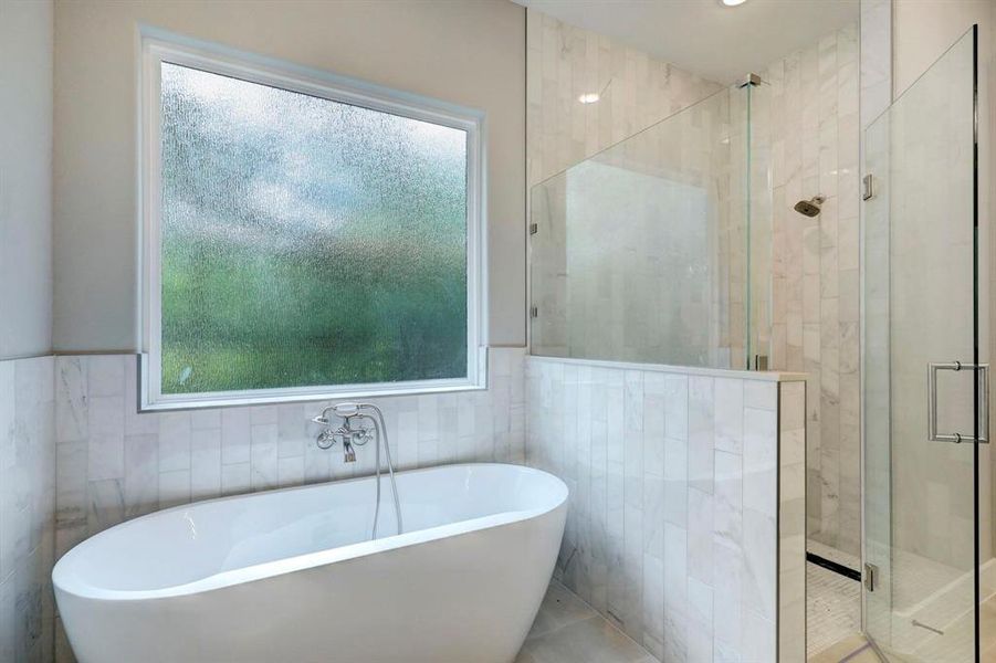 Unwind in your deep soaking tub or jump in the separate shower for a quick rinse.