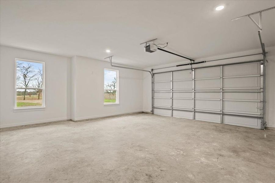 Garage featuring a garage door opener