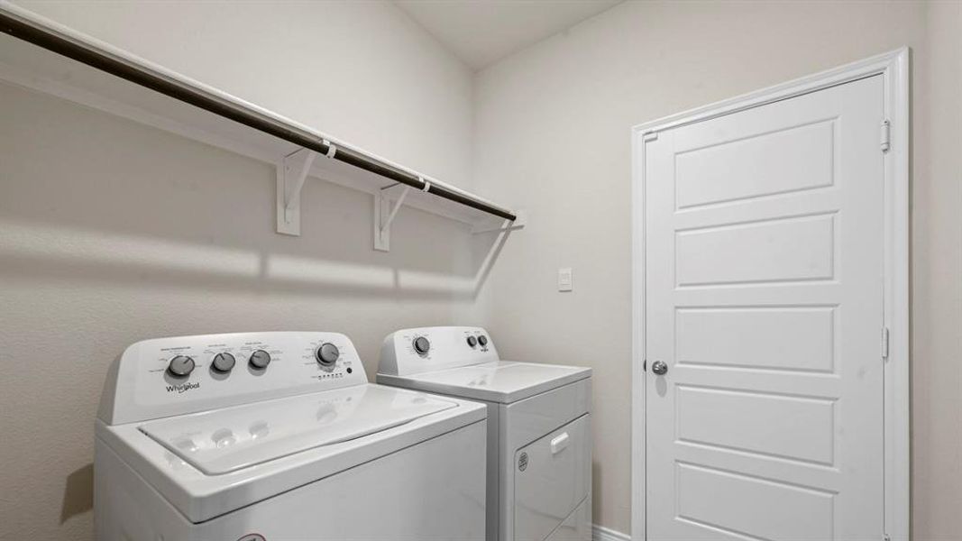 Laundry room with washing machine and clothes dryer Laundry room with washing machine and clothes dryer