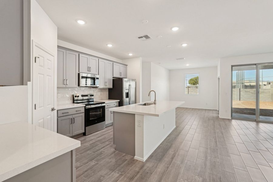 Kitchen and dining. Finishes and options may vary by community