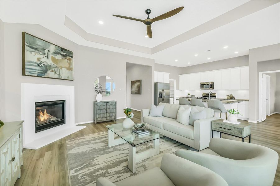 Alternative view of the family room highlighting the seamless flow between the kitchen, cafe, and living areas.