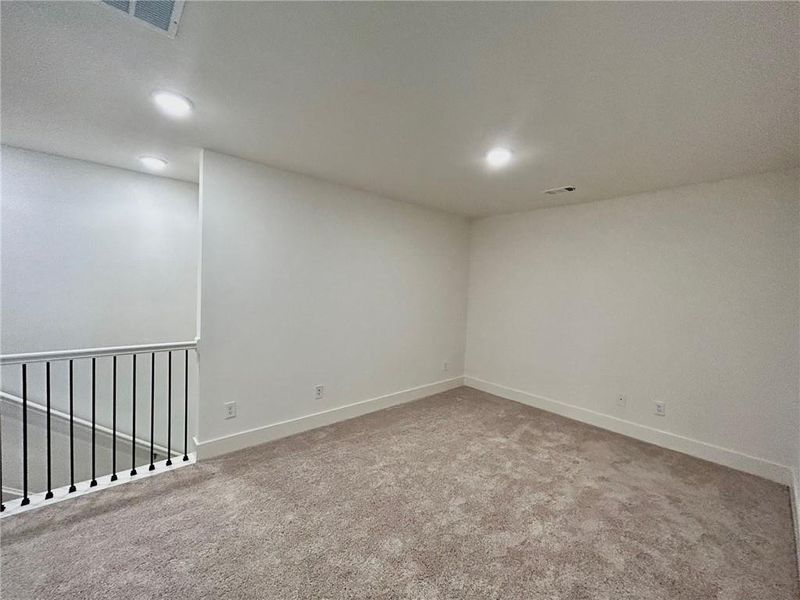 Unfurnished room featuring carpet