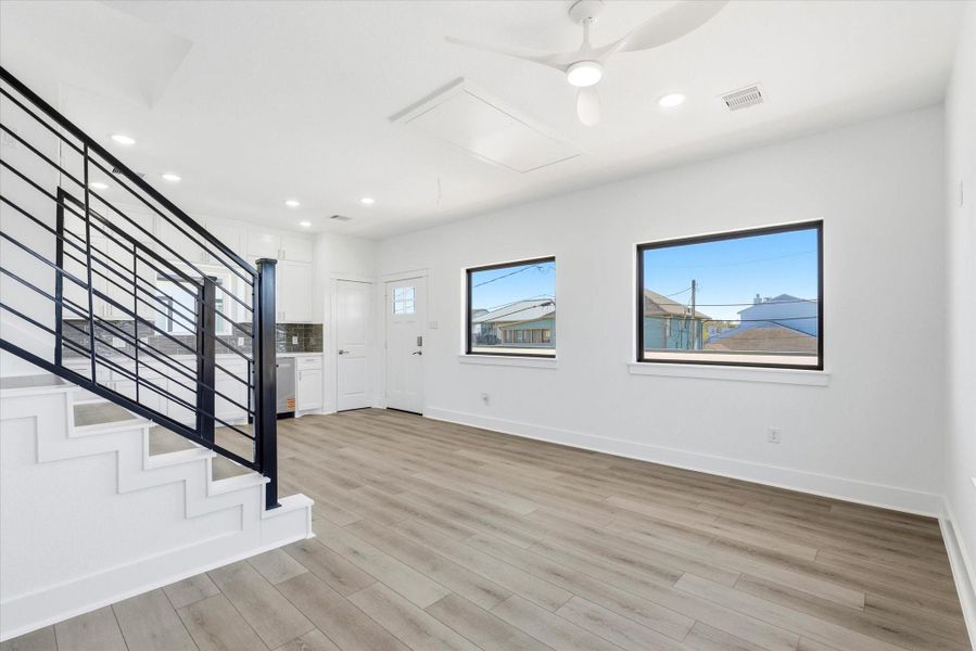 Inside, you’re immediately welcomed by abundant natural light pouring in through three picture windows. This space features durable vinyl flooring found throughout the home, along with recessed lighting and a ceiling fan that add both comfort and brightness. Inside, you’re immediately welcomed by abundant natural light pouring in through three picture windows. This space features durable vinyl flooring found throughout the home, along with recessed lighting and a ceiling fan that add both comfort and brightness.