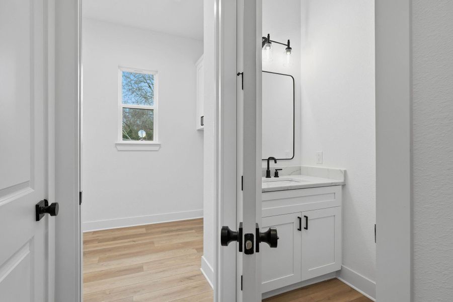 Convenient half bath located for guest use.