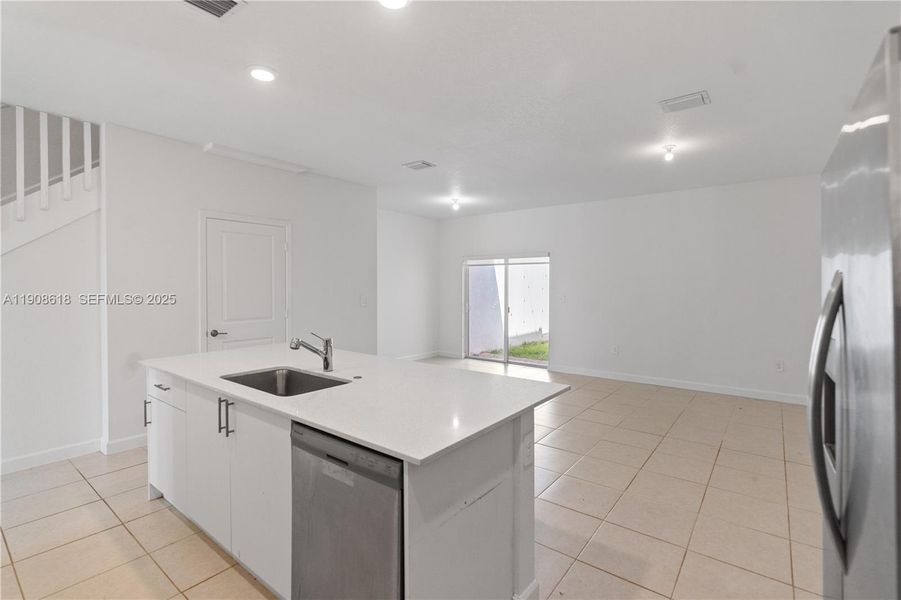 Furnished interior view inside a new home in Harmony Parc, Homestead (Image 11).