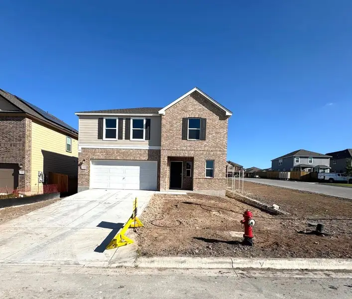 Front exterior of a new home in Sonterra - Cool Water, Jarrell, TX, highlighting curb appeal (Image 1).