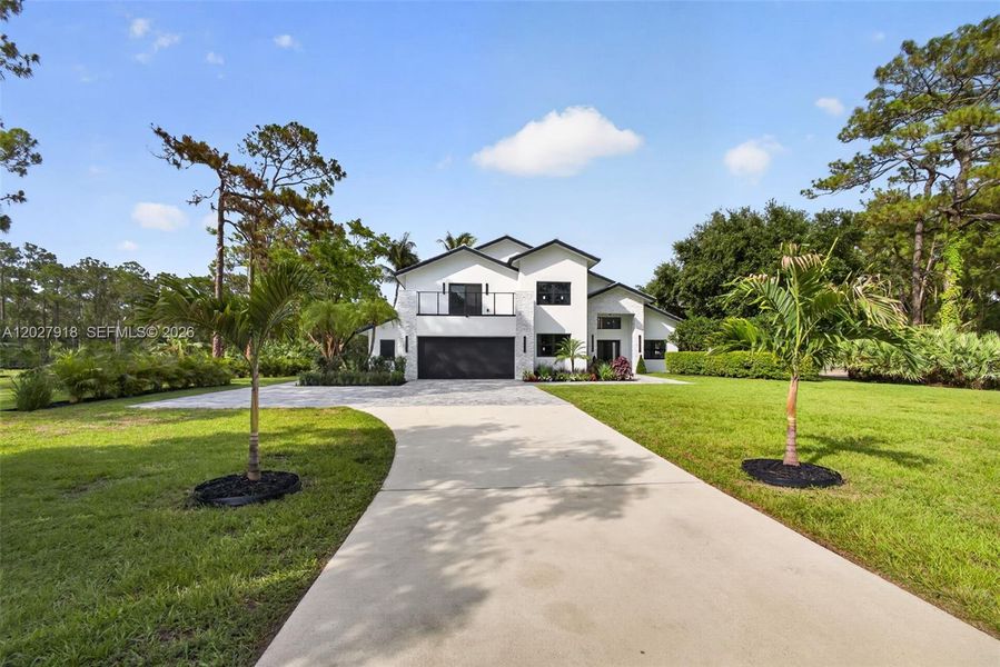 Front exterior of a new home in , Palm Beach Gardens, FL, highlighting curb appeal (Image 29).