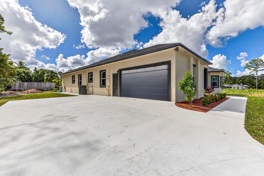 Exterior details and patio area of a home in , The Acreage (Image 29). Exterior details and patio area of a home in , The Acreage (Image 29).