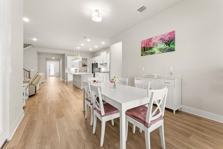 The breakfast area has French doors to the back yard.