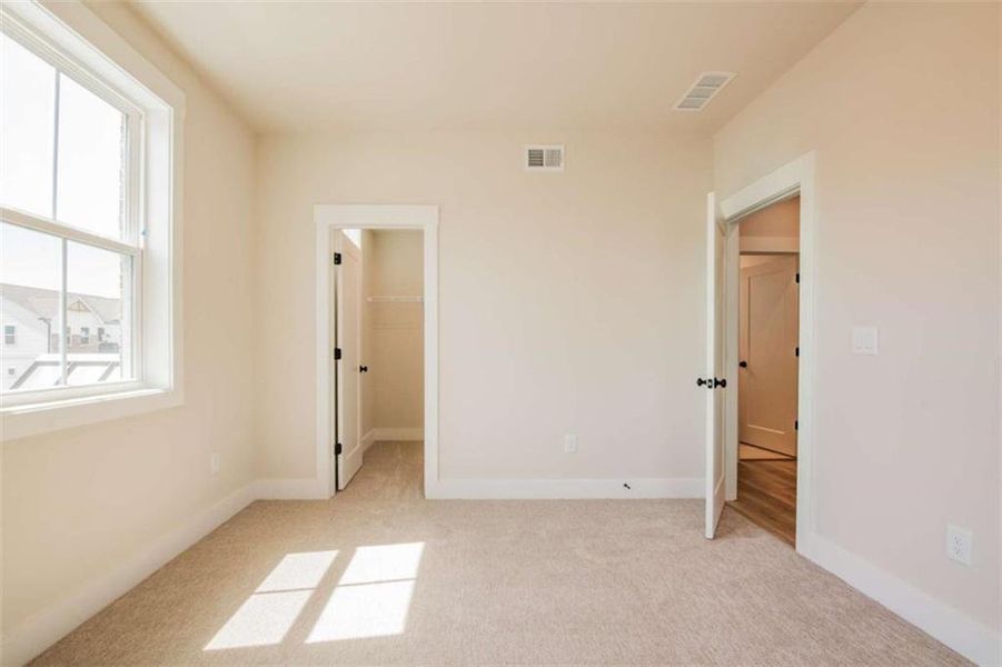 Spacious, unfurnished interior of a new home in The Paddocks at Doc Hughes, Buford (Image 29).