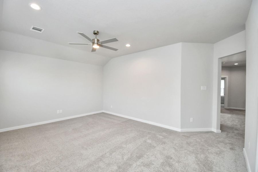 Come upstairs and enjoy a day of leisure in this fabulous game room! This is the perfect hangout spot or adult game room! Features plush carpet, high ceilings, custom paint and windows for plenty of natural light. Sample photo of completed home with similar floor plan. Actual colors and selections may vary.