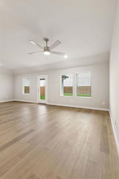 Living Room in the Emmy II home plan by Trophy Signature Homes - REPRESENTATIVE PHOTO