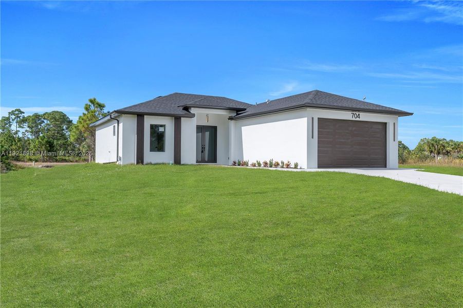 Front exterior of a new home in , Lehigh Acres, FL, highlighting curb appeal (Image 1). Front exterior of a new home in , Lehigh Acres, FL, highlighting curb appeal (Image 1).