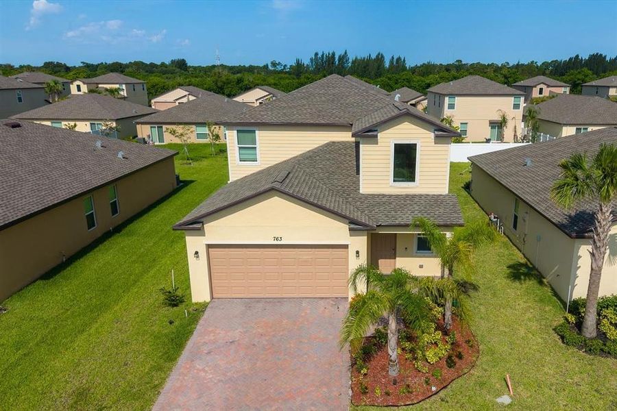 Front exterior of a new home in , Fort Pierce, FL, highlighting curb appeal (Image 23).