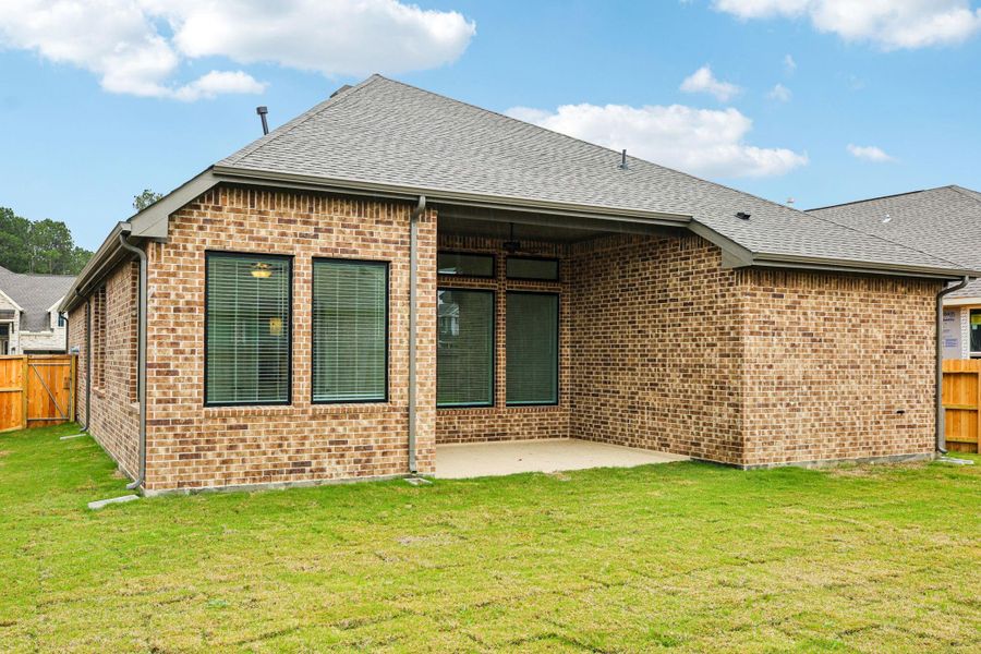 Exterior details and patio area of a home in The Trails, New Caney (Image 4).