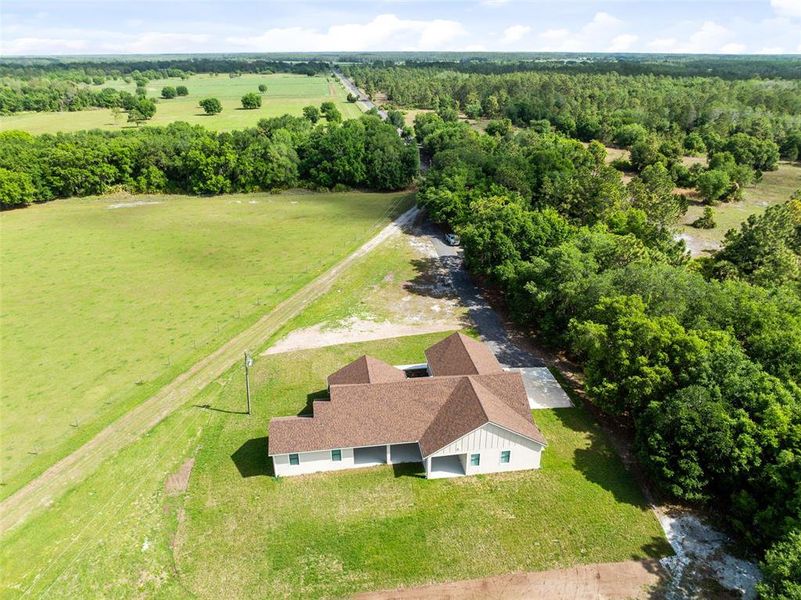 Front exterior of a new home in , Yeehaw Junction, FL, highlighting curb appeal (Image 24).