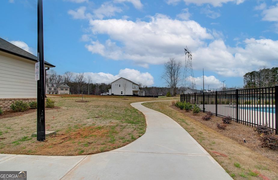 Front exterior of a new home in Ponderosa Farms Manor, Gainesville, GA, highlighting curb appeal (Image 30).
