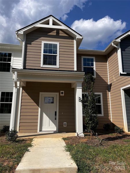 Front exterior of a new home in , Concord, NC, highlighting curb appeal (Image 2).