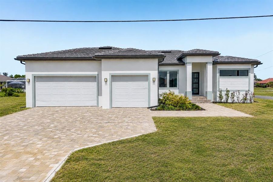 Front exterior of a new home in , Punta Gorda, FL, highlighting curb appeal (Image 1). Front exterior of a new home in , Punta Gorda, FL, highlighting curb appeal (Image 1).