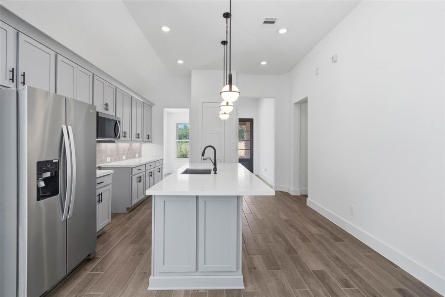 The premium stainless steel appliance package features a spacious french-door refrigerator with a built-in ice and water dispenser. The premium stainless steel appliance package features a spacious french-door refrigerator with a built-in ice and water dispenser.