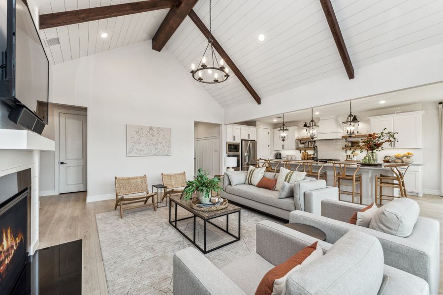 Great room with vaulted ceiling and stained ceiling beams