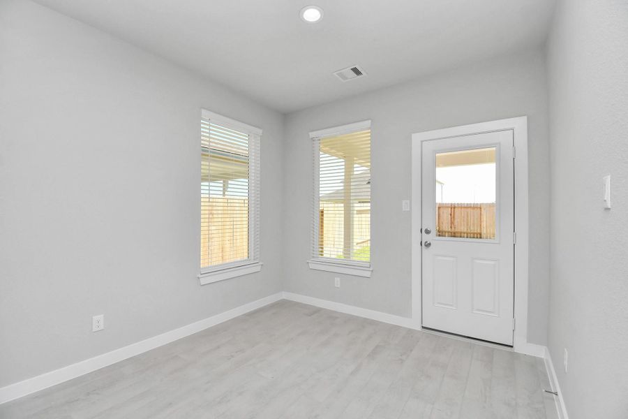 Enjoy breakfast with ease in the connected and cozy breakfast area, seamlessly integrated with the kitchen for utmost convenience. Step through the back door for a breath of fresh air onto the covered patio, extending your living space to the outdoors. Sample photo of completed home with similar floor plan. Actual colors and selections may vary. Enjoy breakfast with ease in the connected and cozy breakfast area, seamlessly integrated with the kitchen for utmost convenience. Step through the back door for a breath of fresh air onto the covered patio, extending your living space to the outdoors. Sample photo of completed home with similar floor plan. Actual colors and selections may vary.