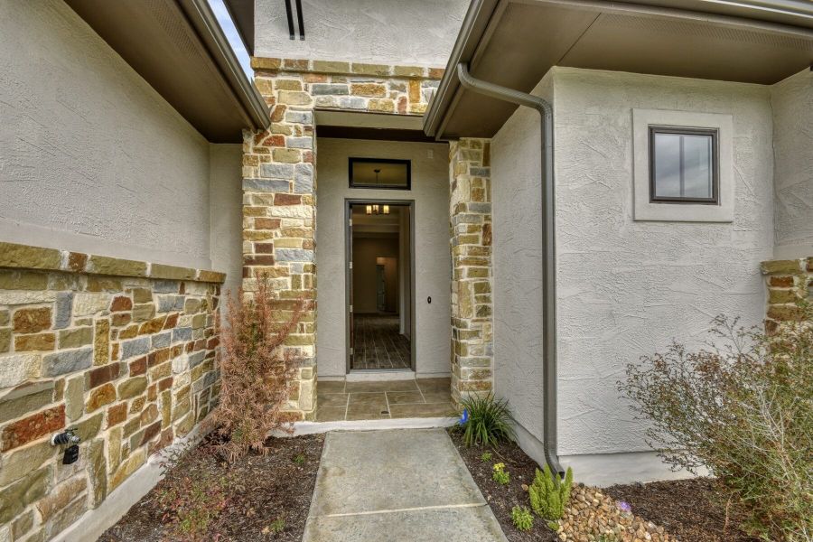 Exterior details and patio area of a home in El Sonido at Campanas, San Antonio (Image 3).