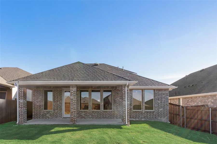 Exterior details and patio area of a home in Villages of Hurricane Creek, Anna (Image 3).