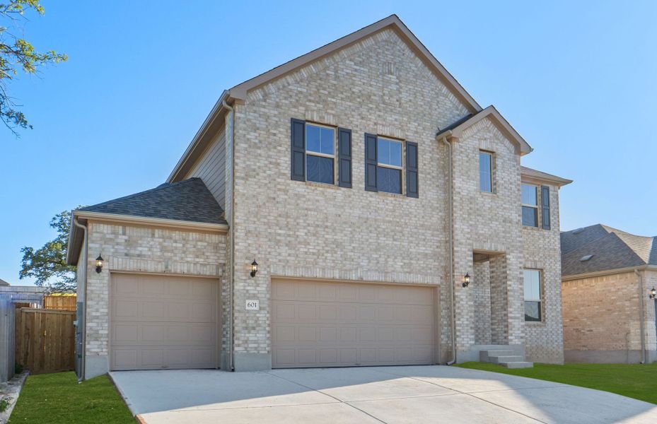 Front exterior of a new home in Crescent Bluff, Georgetown, TX, highlighting curb appeal (Image 20).