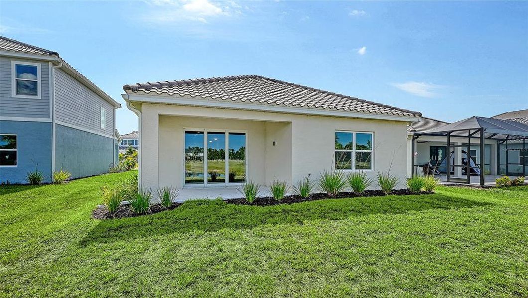 Exterior details and patio area of a home in Grand Park, Sarasota (Image 22).