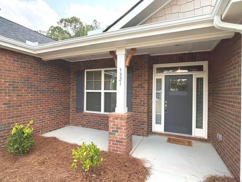 Exterior details and patio area of a home in Tuscany Hills, Douglasville (Image 16).
