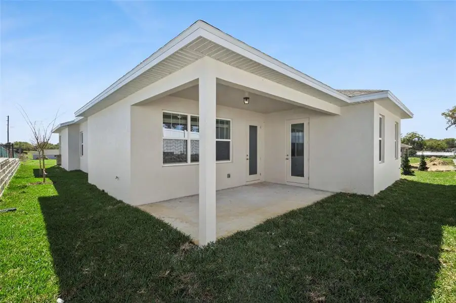 Exterior details and patio area of a home in Grand Isle, Grand Island (Image 3).