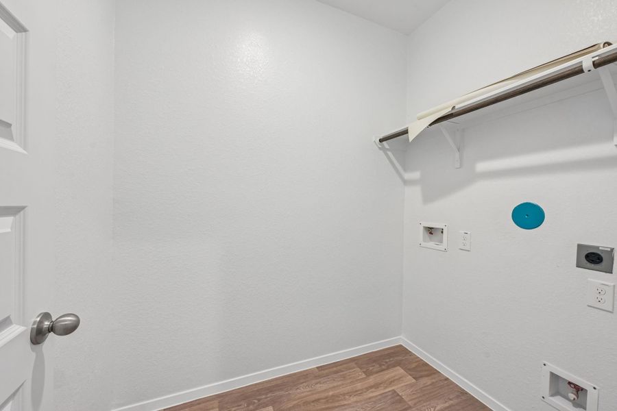 The utility room makes managing everyday tasks easy while keeping everything neat and accessible.