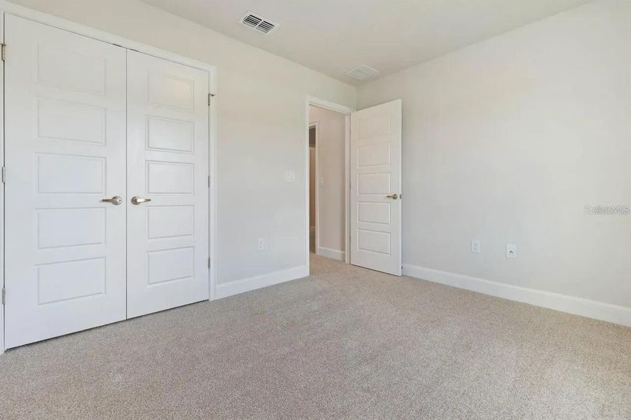 Representative unfurnished interior of a home built from the 1512 by Adams Homes in Winding Oaks, Weeki Wachee (Image 25).
