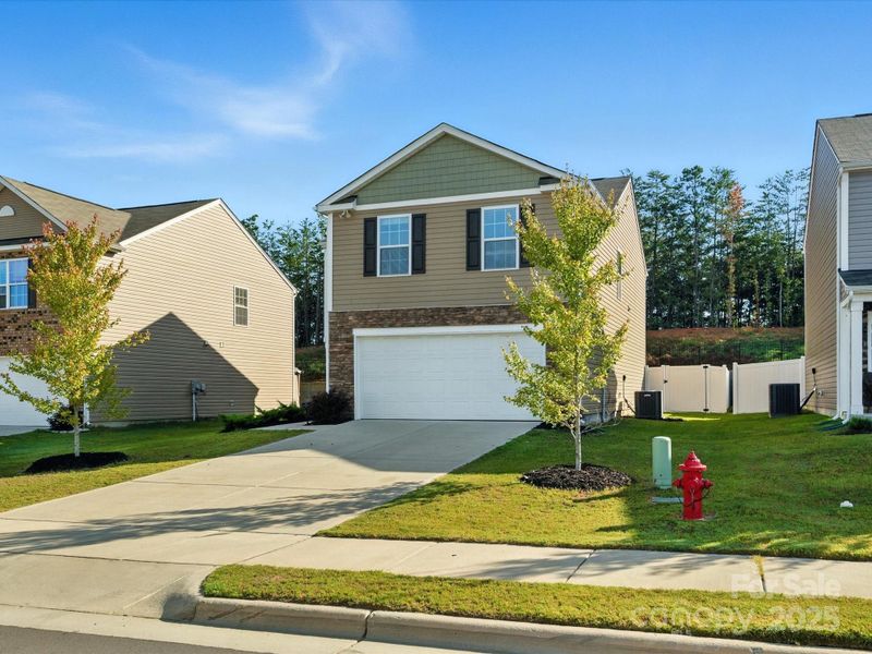 window placement. Mature trees and sidewalks enhance the established neighborhood feel with clean, contemporary styling.