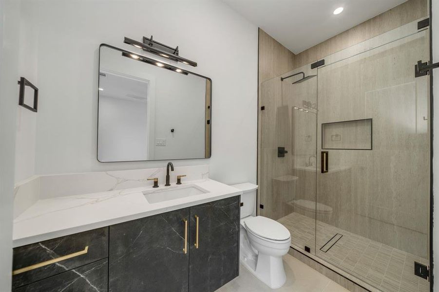 Full bathroom featuring vanity, a shower stall, and recessed lighting Full bathroom featuring vanity, a shower stall, and recessed lighting